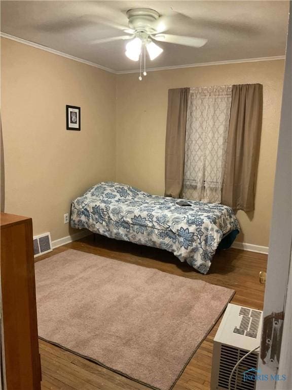 2127 Perth St, Toledo, OH 43607 - bedroom featuring crown molding, wood finished floors, and a ceiling fan