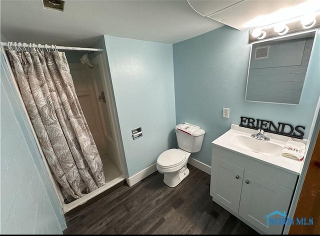 2127 Perth St, Toledo, OH 43607 - bathroom featuring vanity, wood finished floors, and a stall shower