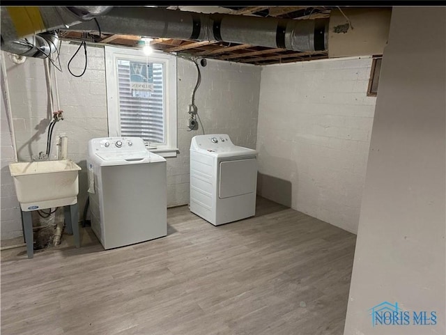 2127 Perth St, Toledo, OH 43607 - washroom with washing machine and dryer and wood finished floors