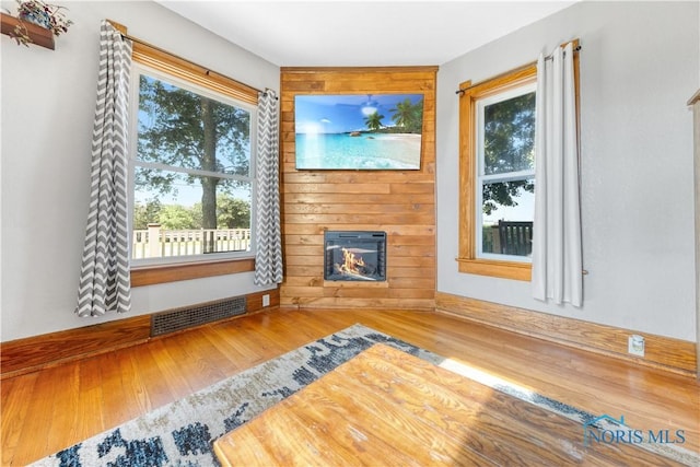 22804 State Route 2, Archbold, OH 43502 - unfurnished living room featuring a fireplace and wood finished floors