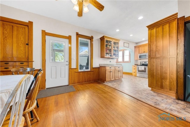 22804 State Route 2, Archbold, OH 43502 - kitchen featuring appliances with stainless steel finishes, ceiling fan, healthy amount of natural light, glass insert cabinets, and recessed lighting