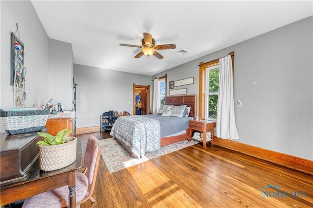 22804 State Route 2, Archbold, OH 43502 - bedroom featuring wood finished floors, ceiling fan, and a walk in closet