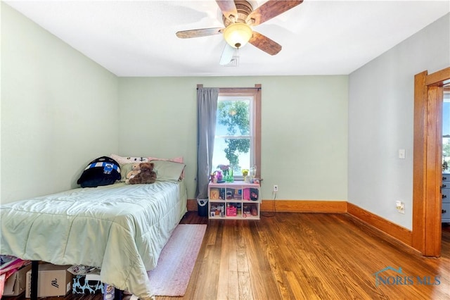 22804 State Route 2, Archbold, OH 43502 - bedroom with wood-type flooring and a ceiling fan