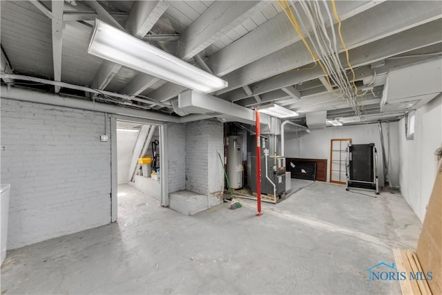 22804 State Route 2, Archbold, OH 43502 - unfinished basement with electric water heater, heating unit, and brick wall