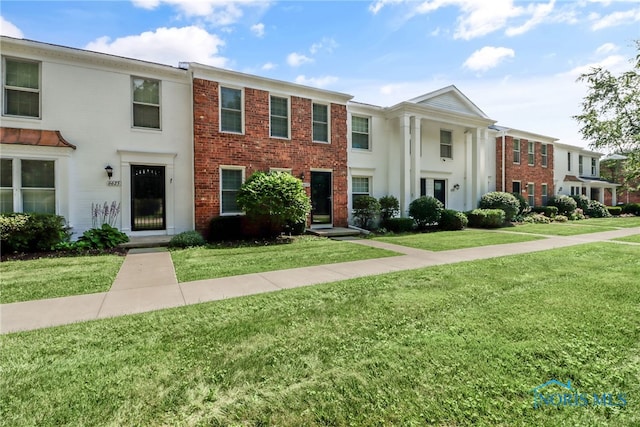 6627 Garden Rd Unit 6627, Maumee, OH 43537 - view of front of house featuring a front lawn and brick siding