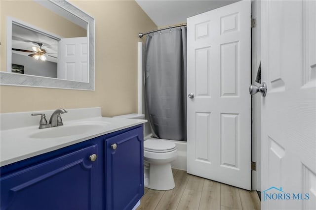 6627 Garden Rd Unit 6627, Maumee, OH 43537 - full bathroom featuring vanity, wood finished floors, shower / tub combo with curtain, and ceiling fan