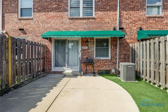6627 Garden Rd Unit 6627, Maumee, OH 43537 - property entrance featuring brick siding and a patio