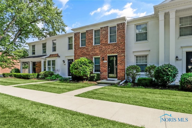 6627 Garden Rd Unit 6627, Maumee, OH 43537 - view of front of property with a front lawn and brick siding