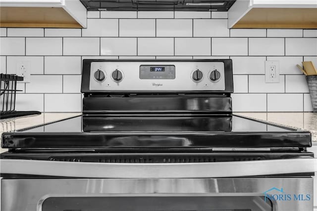 6627 Garden Rd Unit 6627, Maumee, OH 43537 - kitchen view of electric range and backsplash