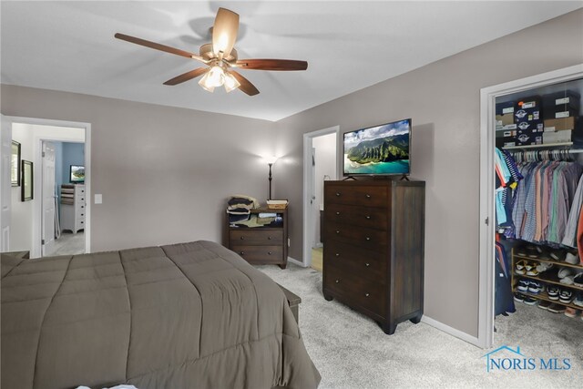 6627 Garden Rd Unit 6627, Maumee, OH 43537 - bedroom featuring light colored carpet, a walk in closet, and a ceiling fan
