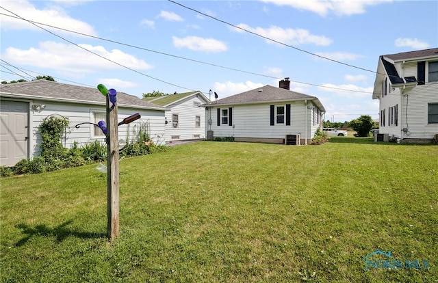 212 18th St, Findlay, OH 45840 - back of house featuring a lawn
