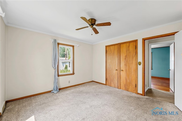 212 18th St, Findlay, OH 45840 - unfurnished bedroom with carpet, a closet, crown molding, and ceiling fan
