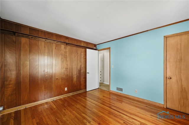 212 18th St, Findlay, OH 45840 - unfurnished bedroom featuring wood finished floors and ornamental molding