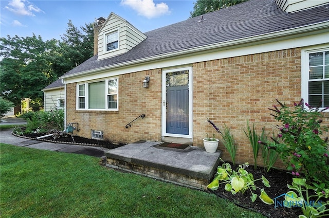 2838 Secor Rd, Toledo, OH 43606 - entrance to property with brick siding, roof with shingles, and a yard