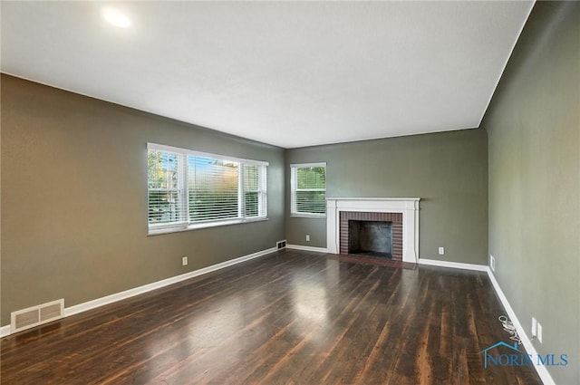 2838 Secor Rd, Toledo, OH 43606 - unfurnished living room with wood finished floors and a brick fireplace