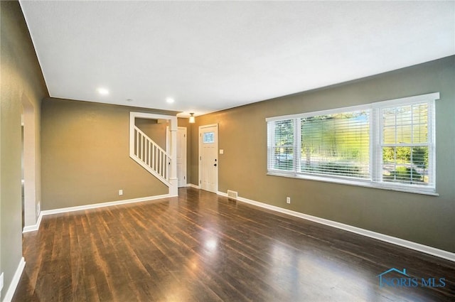 2838 Secor Rd, Toledo, OH 43606 - unfurnished living room with wood finished floors, stairway, and recessed lighting