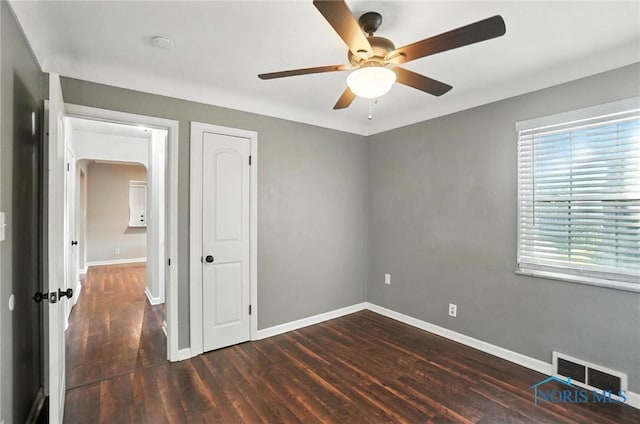 2838 Secor Rd, Toledo, OH 43606 - unfurnished bedroom with wood finished floors, ceiling fan, and a closet