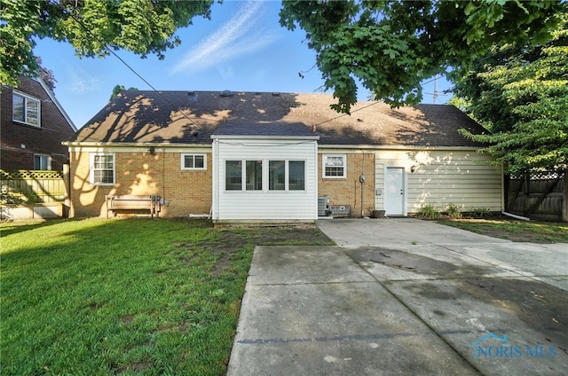 2838 Secor Rd, Toledo, OH 43606 - back of property with brick siding, a patio, and a shingled roof