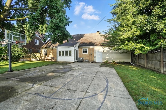 2838 Secor Rd, Toledo, OH 43606 - back of property with a patio area and brick siding
