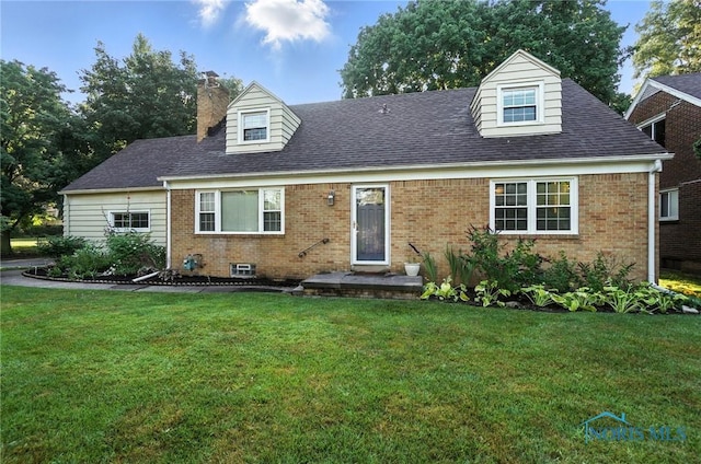 2838 Secor Rd, Toledo, OH 43606 - cape cod home featuring brick siding, a front yard, a chimney, and roof with shingles