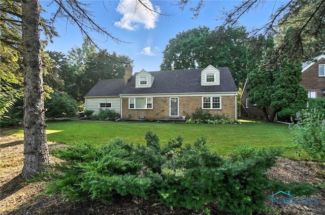 2838 Secor Rd, Toledo, OH 43606 - cape cod house with brick siding, a front yard, and a chimney