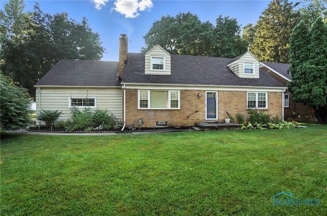 2838 Secor Rd, Toledo, OH 43606 - new england style home featuring brick siding, a front yard, a chimney, and a shingled roof