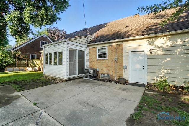 2838 Secor Rd, Toledo, OH 43606 - back of property with a patio area, brick siding, and roof with shingles