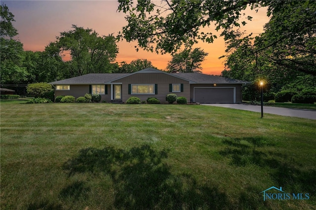 621 Bittersweet Dr, Findlay, OH 45840 - ranch-style house featuring driveway, a front yard, and a garage