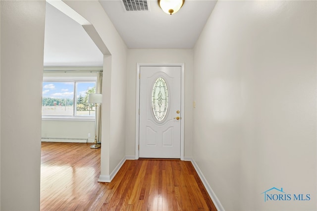 621 Bittersweet Dr, Findlay, OH 45840 - foyer featuring light wood-style flooring and a baseboard heating unit