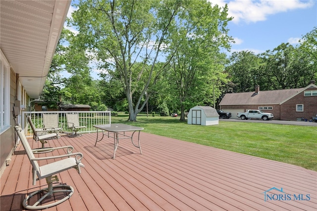 621 Bittersweet Dr, Findlay, OH 45840 - wooden terrace featuring a storage shed, a yard, and view of wooded area
