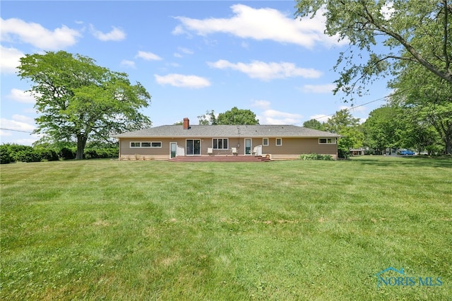 621 Bittersweet Dr, Findlay, OH 45840 - back of house with a deck, a chimney, and a lawn