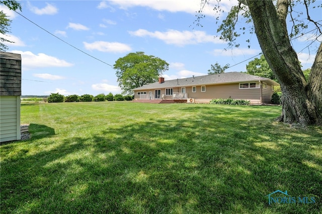 621 Bittersweet Dr, Findlay, OH 45840 - view of grassy yard with a wooden deck