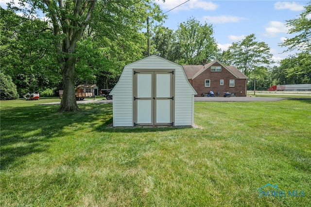 621 Bittersweet Dr, Findlay, OH 45840 - view of shed featuring view of wooded area