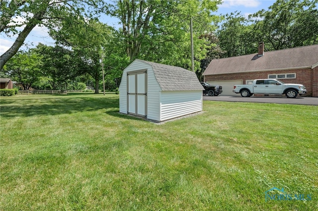 621 Bittersweet Dr, Findlay, OH 45840 - view of grassy yard with a storage shed and view of wooded area