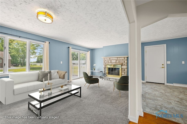 621 Bittersweet Dr, Findlay, OH 45840 - living area featuring a textured ceiling and a stone fireplace