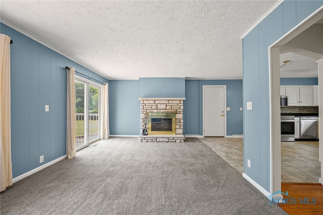 621 Bittersweet Dr, Findlay, OH 45840 - unfurnished living room featuring a textured ceiling, a fireplace, and carpet floors