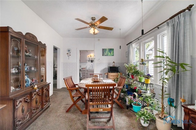 3867 Almeda Dr, Toledo, OH 43612 - carpeted dining room with a wainscoted wall and ceiling fan