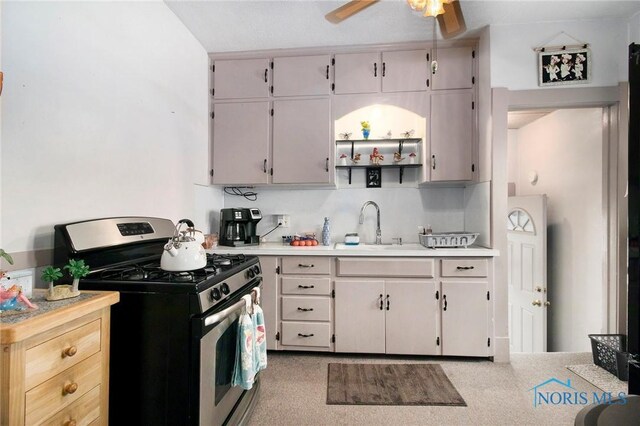 3867 Almeda Dr, Toledo, OH 43612 - kitchen featuring stainless steel gas range oven, light countertops, and ceiling fan