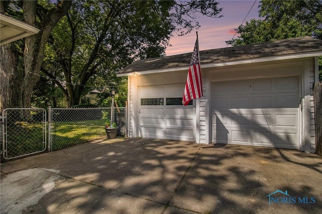 3867 Almeda Dr, Toledo, OH 43612 - garage at dusk with a garage