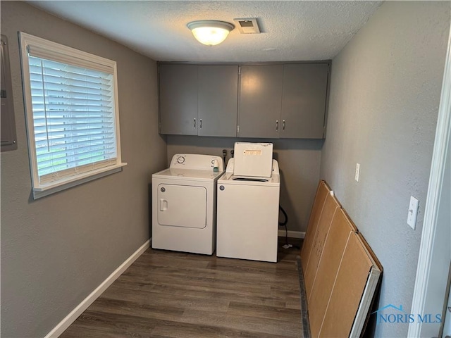 1712 Maumee Dr, Defiance, OH 43512 - laundry area featuring cabinet space, independent washer and dryer, dark wood-type flooring, and a textured ceiling