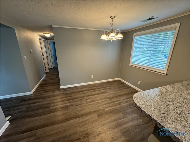 1712 Maumee Dr, Defiance, OH 43512 - dining space featuring a chandelier, dark wood-style floors, a textured ceiling, and crown molding