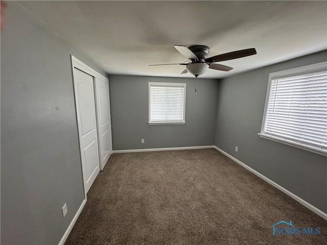 1712 Maumee Dr, Defiance, OH 43512 - unfurnished bedroom featuring carpet floors, a closet, and a ceiling fan