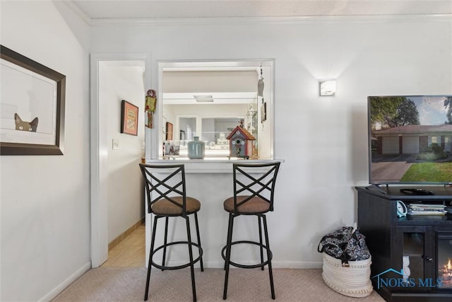 3468 Hughes Blvd, Toledo, OH 43606 - indoor bar featuring crown molding and light carpet