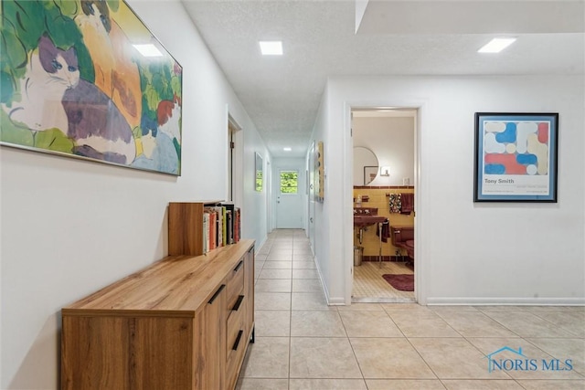 3468 Hughes Blvd, Toledo, OH 43606 - hallway with light tile patterned flooring and baseboards