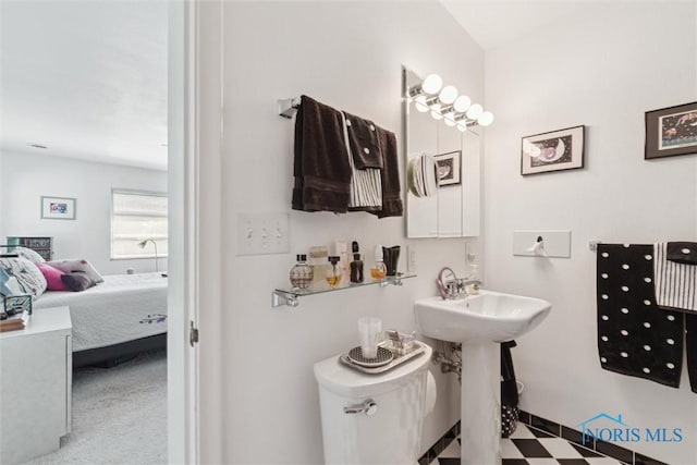 3468 Hughes Blvd, Toledo, OH 43606 - ensuite bathroom featuring toilet and tile patterned floors