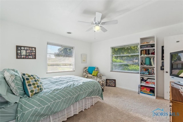 3468 Hughes Blvd, Toledo, OH 43606 - carpeted bedroom with multiple windows and ceiling fan