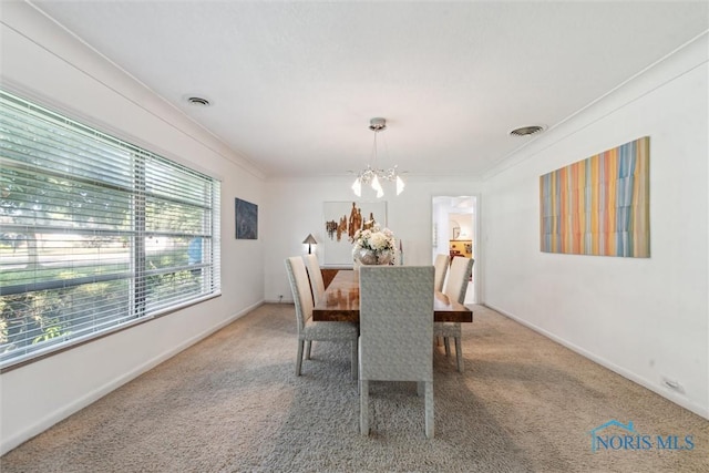 3468 Hughes Blvd, Toledo, OH 43606 - carpeted dining space with a chandelier and ornamental molding