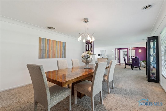 3468 Hughes Blvd, Toledo, OH 43606 - dining space featuring light carpet, a chandelier, and healthy amount of natural light