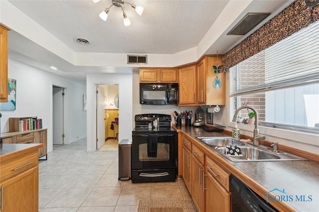 3468 Hughes Blvd, Toledo, OH 43606 - kitchen featuring black appliances, brown cabinets, a textured ceiling, light tile patterned floors, and dark countertops