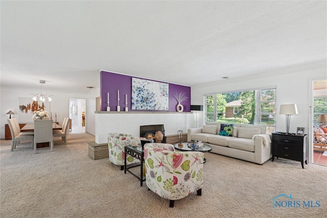 3468 Hughes Blvd, Toledo, OH 43606 - living area with carpet, healthy amount of natural light, a chandelier, and a brick fireplace